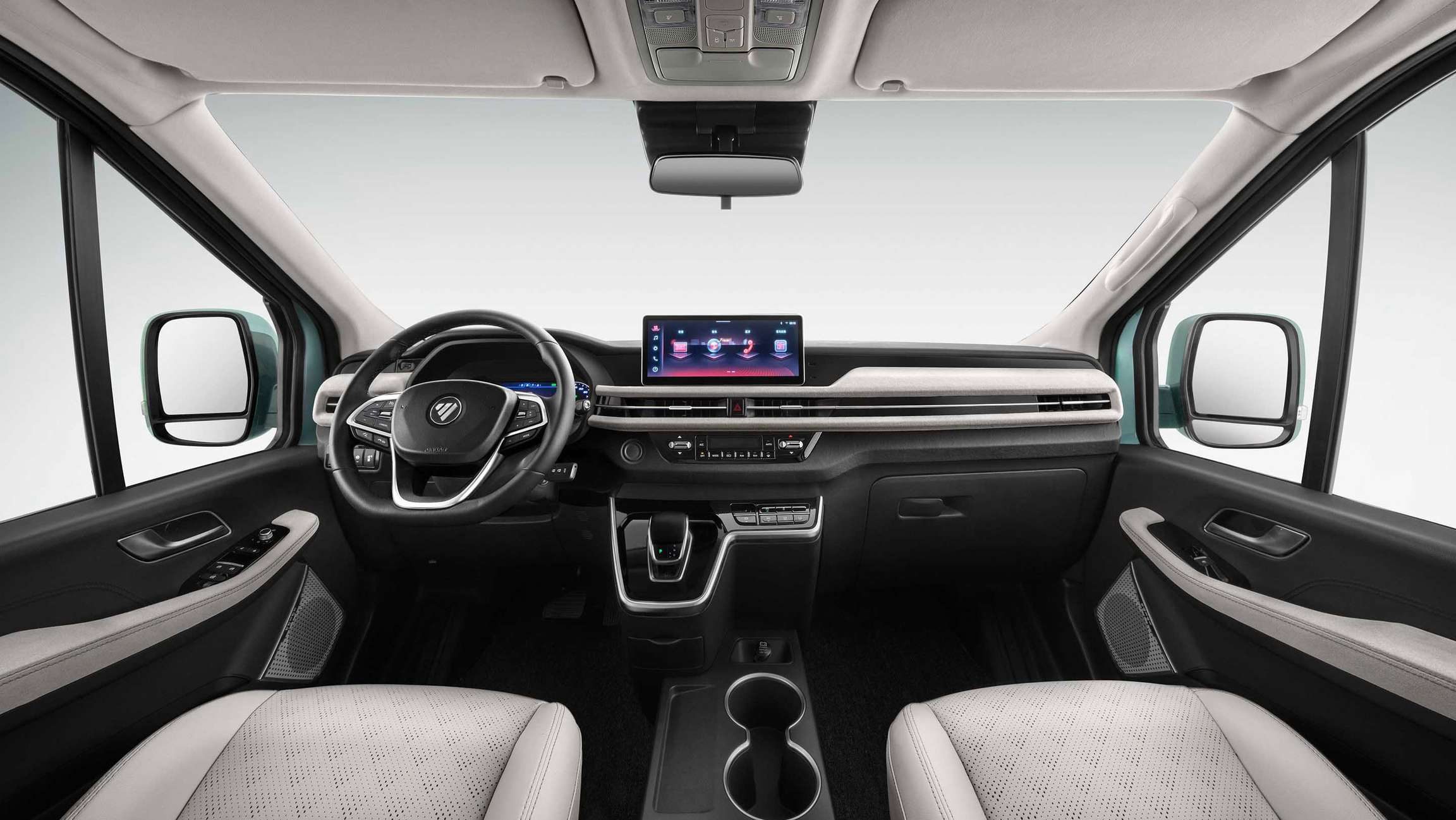 The EView Grand cabin seen from the second row: steering wheel, 12.3-inch touch screen, and light grey perforated seats