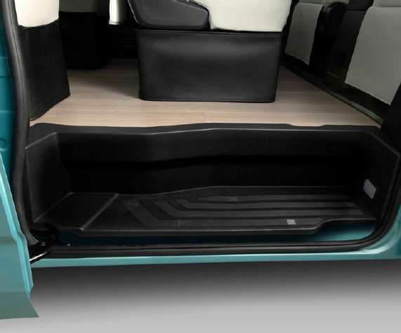 The PVC carpet flooring at the sliding side door